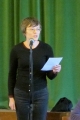 Māc. Elīza Zikmane lasa ziņojumu no Rietumanglijas - Velsas draudzes